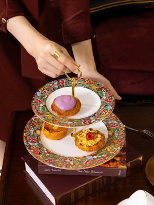Guangcai Legacy 2-Piece Cake Set, hand holding tiered tray filled with pastries